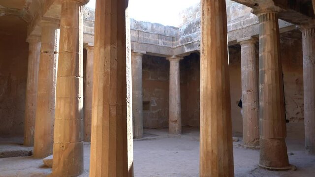 Paphos, Cyprus - September 2021: View of the Tombs of the Kings. Ruins of the old city, archaeological excavations of the Tsar's ruins.