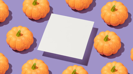 Creative composition with orange pumkin on bold purple background and white paper card. Trendy autumn or halloween template.