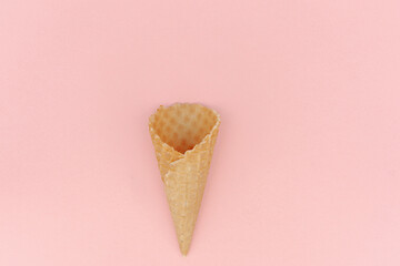 An overhead flatlay shot of white meringue nests shot on a pink background