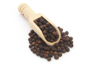 Wooden scoop on black peppercorns isolated on white background