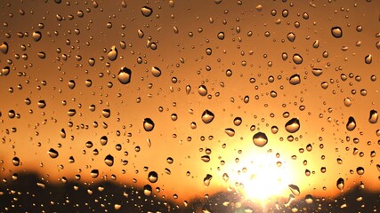 water droplets on clear glass sun light brown background