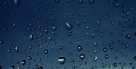 water droplets on glass blue background