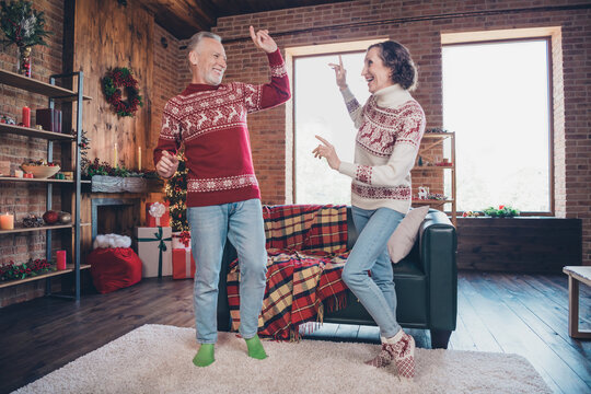 Full length body size photo couple dancing before new year in decorated apartment