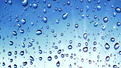 water droplets on glass blue background