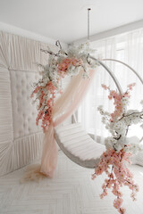 swing decorated with flowers