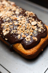 Chocolate and almond cake freshly baked vertical stills with grey copy space.