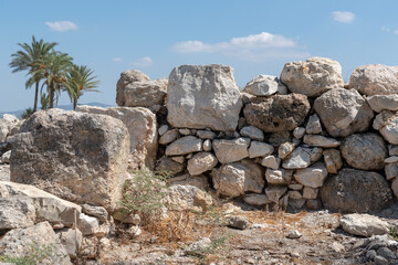 Fototapeta na wymiar Ancient stone wall at Tel Megiddo National Park in northern Israel