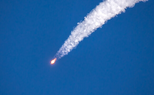 Falling rocket. The explosion of a rocket launcher and the fall of the spaceship. A real rocket in flight, a rocket launch from the Baikonur cosmodrome, a flying rocket in the sky.