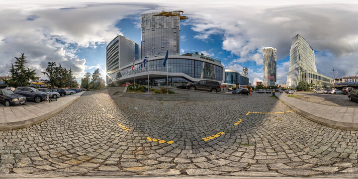 BATUMI, GEORGIA - SEPTEMBER 2021: full seamless 360 hdri panorama near modern skyscrapers, hotel or office buildings in equirectangular spherical projection, for VR AR content