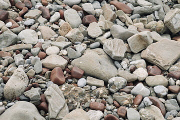 Sea stones in water background close-up.