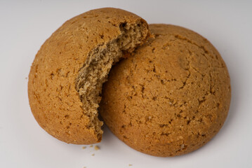 Two cookies on a white background closeup.