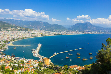 Landscape view of the Alanya bay in Turkey with pirate ships, lighthouse and Red Tower