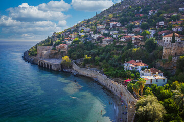 Alanya castle in Turkey with the sea bay and old harbor and lighthouse