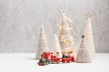 Christmas craft background with handmade yarn cone xmas trees in natural colors.  DIY organic...