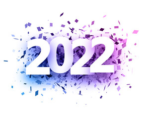 2022 white sign over colourful confetti.