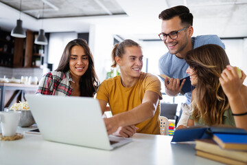 Obraz premium Group of young business people and designers working on project. Startup concept.