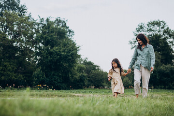 Obraz premium Mother with her daughter having fun together in park