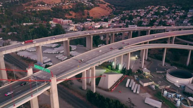 Aerial: Freeway traffic coming off the Alfred Zampa Memorial Bridge and Carquinez Bridge between Oakland and Vallejo. California, USA