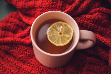 A cup of hot tea with lemon. Warming autumn drink. Autumn