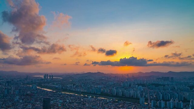 Seoul city skyline and Seoul tower modern building and architecture, Beautiful clouds flow through the Seoul tower during sunset  in downtown Seoul, South Korea