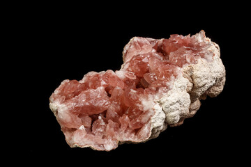 Macro mineral stone Pink Amethyst on a black background