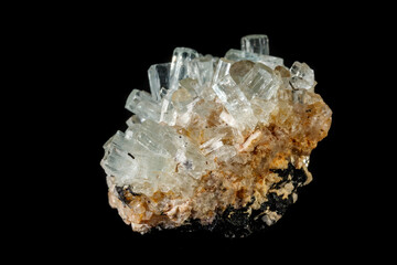 Fototapeta premium Macro mineral stone crystals Aquamarine in rock on a black background