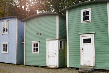 Fototapeta na wymiar Traditional multicolored wooden fishing huts are a local landmark in Malmo, Sweden.