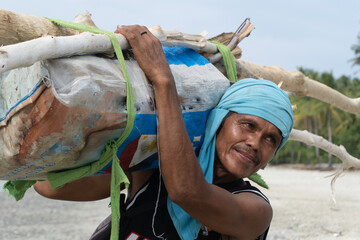 Village fire wood collector. Traditional culture. Philippines
