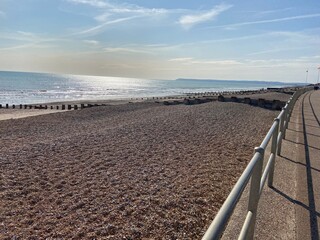 Fototapeta na wymiar Sussex beach pebbles sea and sun