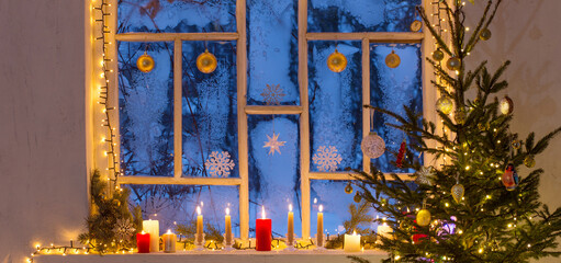Christmas decorations on old wooden window