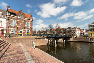 Fototapeta na wymiar Canal houses and bridge in the center of Gorinchem in the Netherlands.