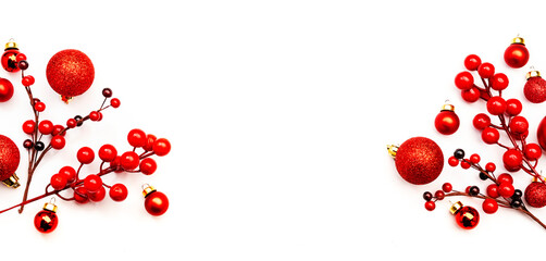 White Christmas and New Year background with red Christmas balls and berries, top view,copy spase