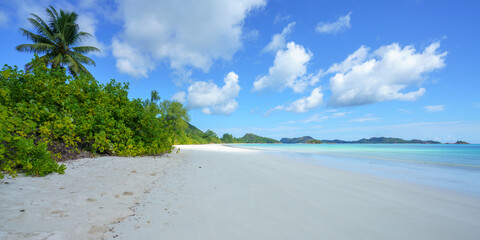 tropical beach at anse volbert on praslin on the seychelles