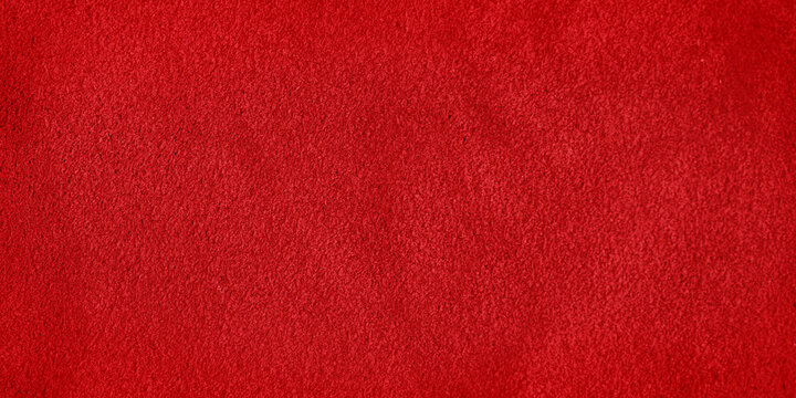 Red suede leather texture. Macro photo of a red velvet texture.