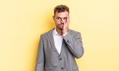 young handsome man feeling bored, frustrated and sleepy after a tiresome. business concept