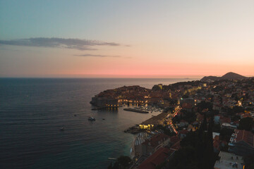 Fototapeta na wymiar Travel to Croatia. Aerial night image of summer sky. Popular tourist destination in Hrvatska, Dubrovnik has hundreds of tourists to take pictures of the medieval fortification that has become iconic