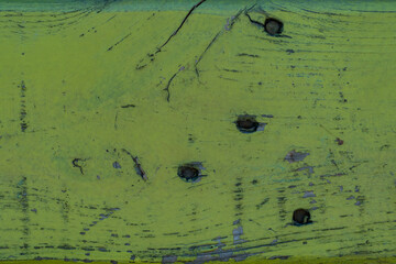 Metal wall painted with green paint Corrosion on a rough metal wall or floor, scratches, air holes, holes, dents in the garage.