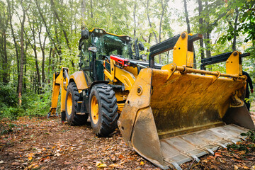 bulldozer at work site in forest