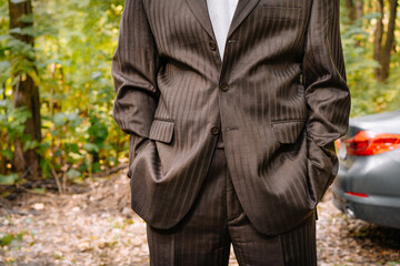 man in suit in the forest