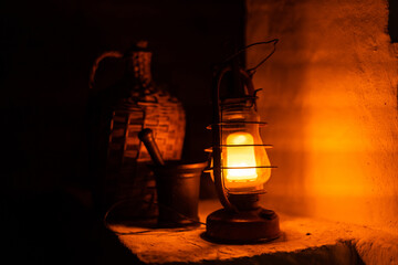 Fototapeta na wymiar Old fashioned lantern in darkness. Light concept.