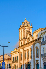 Fototapeta na wymiar Facade of an old and historic church from the 18th century in the central square of the Pelourinho district in the city of Salvador, Bahia at afternoon
