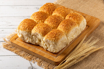 Coconut bread on the wooden table.