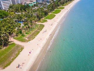 Aerial drone shot of Sanya bay beach with tourists Sanya city Hainan island China