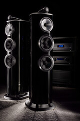 Expensive premium home floor acoustics in the dark. High-end amplifier, equipment rack, audiophile...