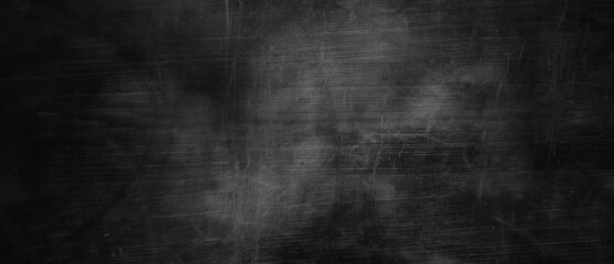 Obraz na płótnie Canvas Dark gray cement scratches for the background. Foggy black cement. Shabby dark walls