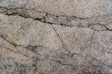 Old gravel floor or wall which is cracked and is waiting to be repaired to be beautiful
