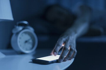 Woman receiving a phone call late at night