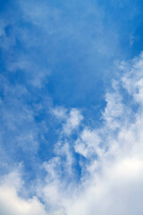 Blue sky background with white clouds.