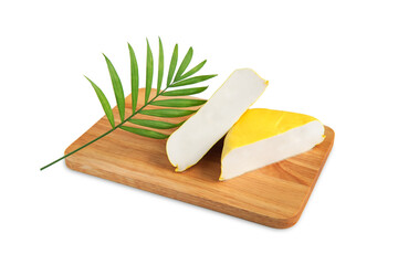Tofu yellow or Soy bean curd with green palm leaf on wooden cutting board, Isolated on white background, Protein nutrients for Vegetarian or Vegan, Cooking clean food, Healthy and Health care concept.