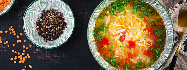 Chicken soup with red lentils and paprika. Traditional Mediterranean food. Healthy food. Top view, banner, above